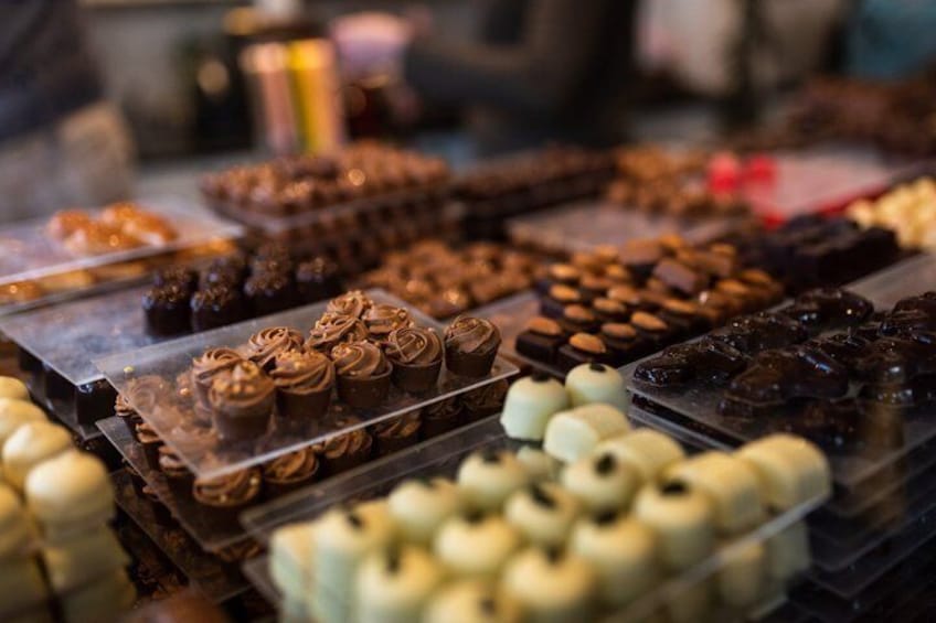 A variety of pastries and desserts displayed on trays. 3