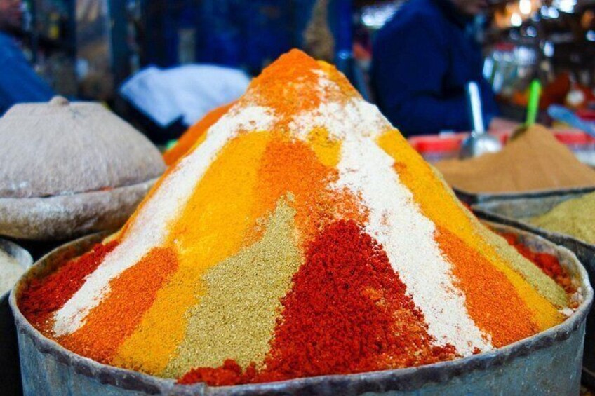 A pyramid of spices with red, yellow, and white colors. 2