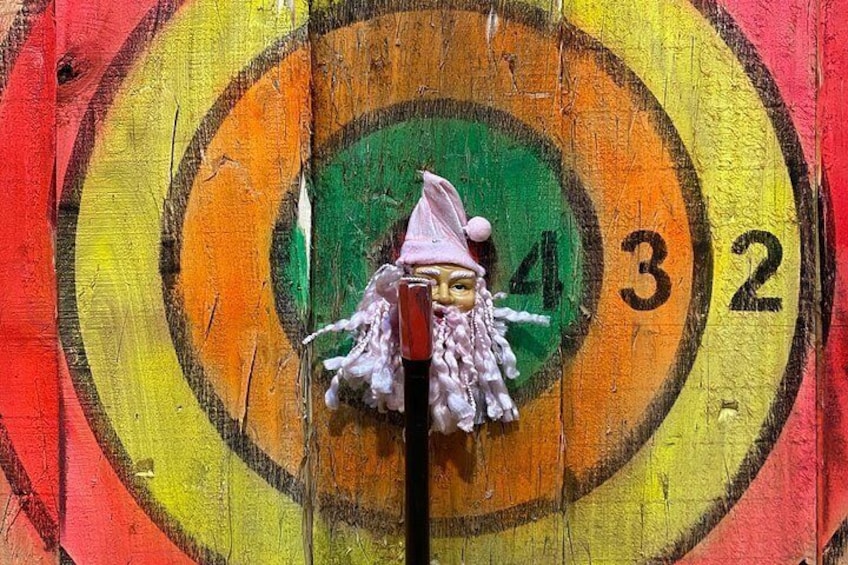 A dartboard with a target and numbers 3 and 2 visible. 3