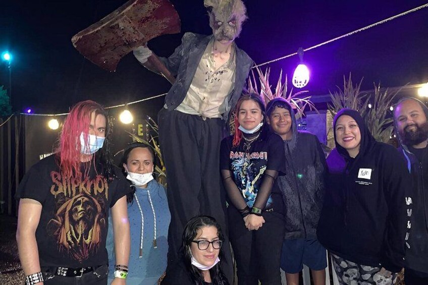 A group of people posing with a person in a costume. 5