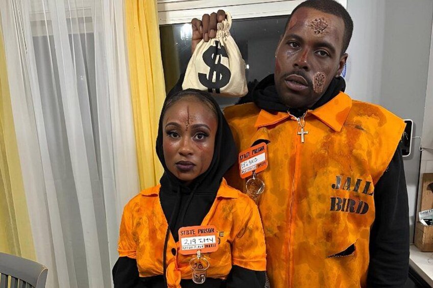 Two individuals wearing orange vests with 'JAIL BIRD' text, holding a bag with a dollar sign. 2