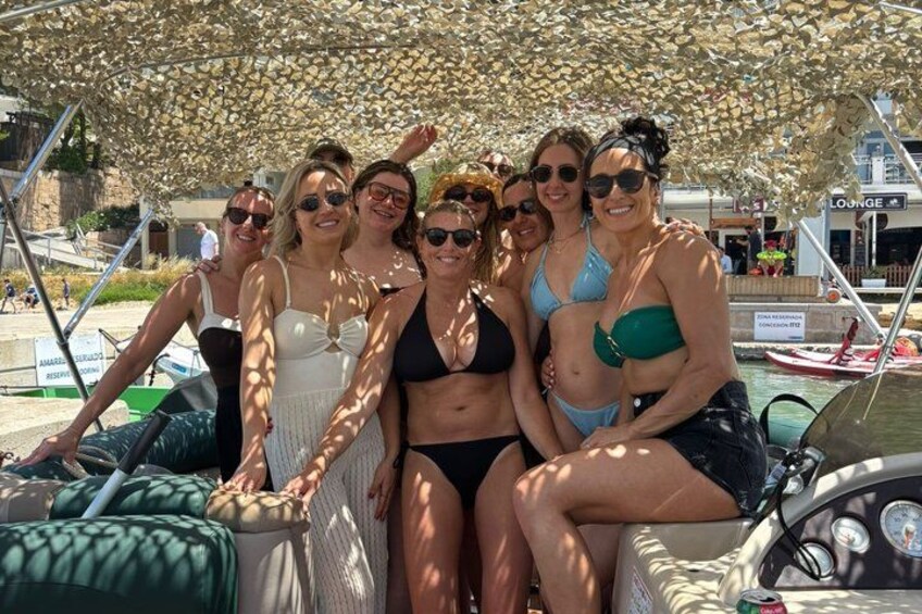 A group of people on a boat with a canopy overhead. 3