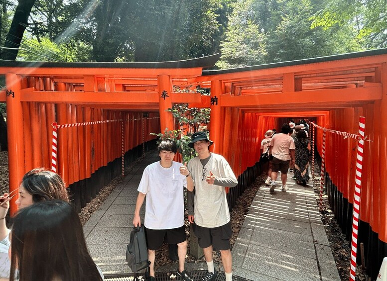 A pathway lined with red torii gates, leading to a shrine. 3