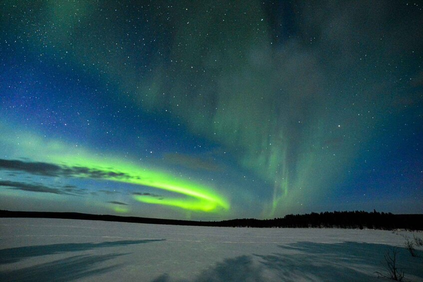 A snowy landscape with the Northern Lights. 3