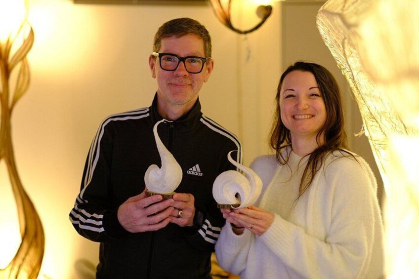 A person holding a swan-shaped object. 4
