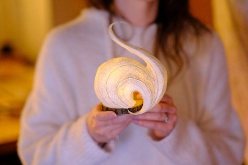 A person holding a spiral object. 2