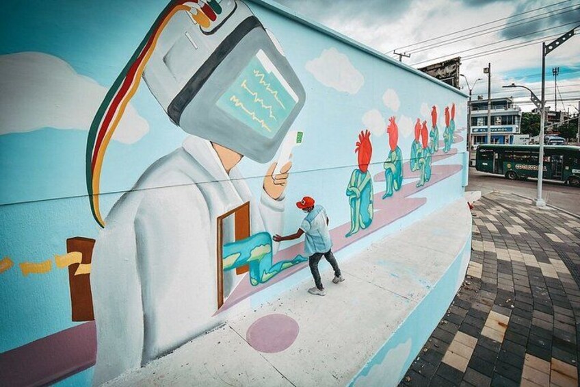 A mural with a medical theme, a person in a white coat, and a child. 2