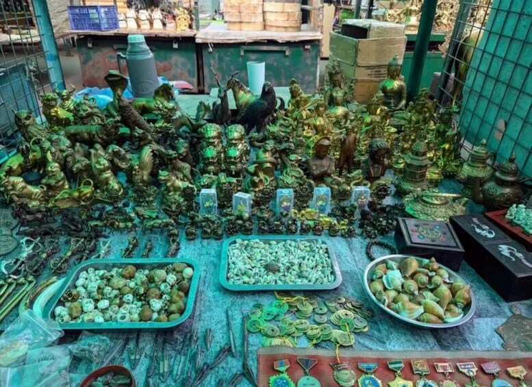 A collection of brass figurines and decorative items on display. 2