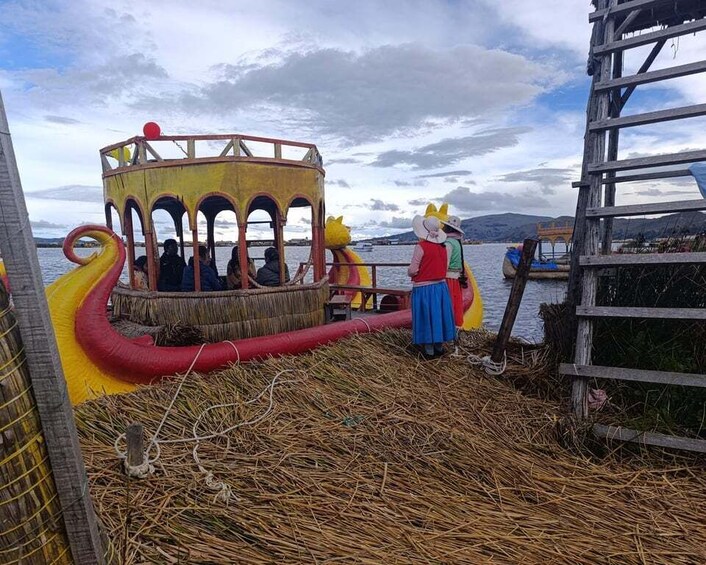 A wooden boat with arches and a yellow top, a person in a blue skirt and red top, and a red and yellow slide. 5