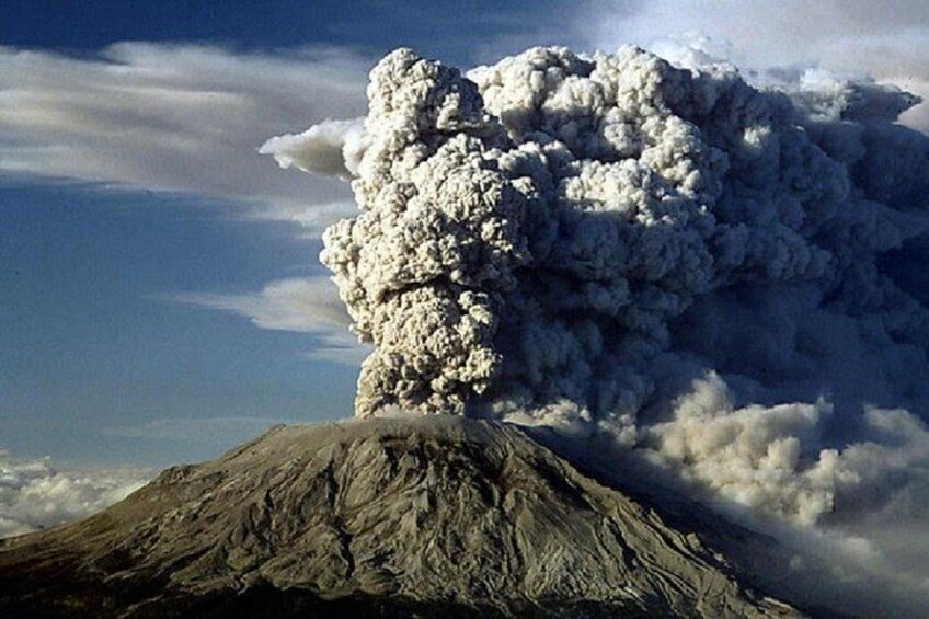 A volcano with a large plume of smoke or ash. 5