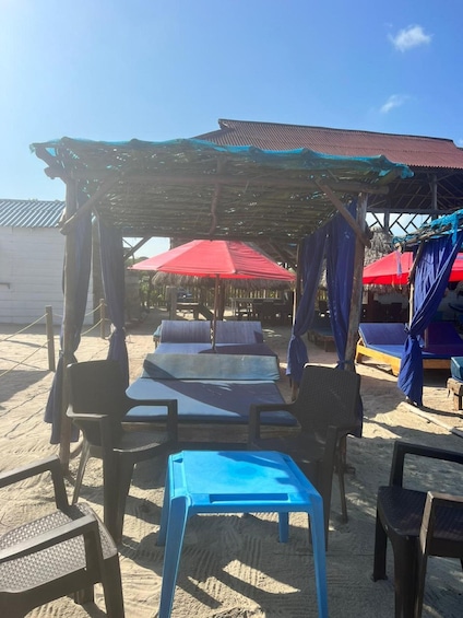 A beachside café with outdoor seating and umbrellas. 2