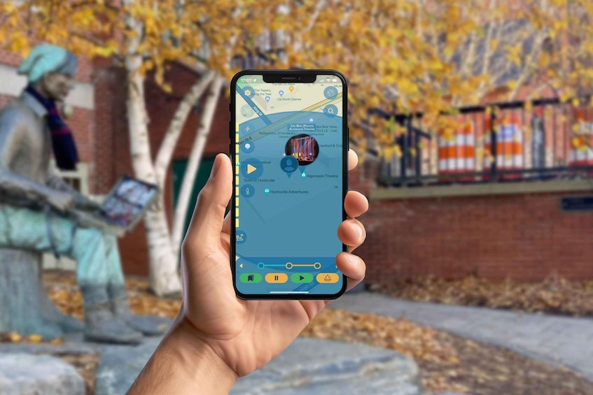 A hand holding a smartphone displaying a map with a location pin, a play button, and a settings gear icon. 1