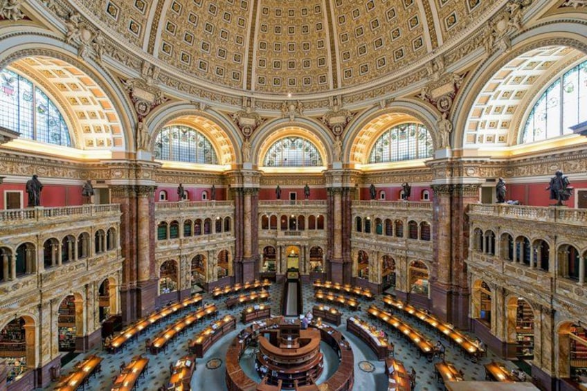 A grand hall with a high, ornate ceiling and multiple arched windows. 3