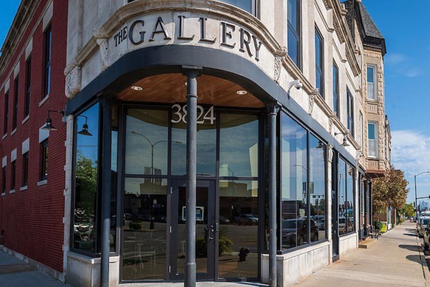 A building with a sign reading 'The Gallery' and the number 3824. 3