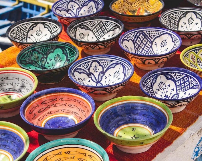 A collection of colorful ceramic bowls with intricate patterns. 5