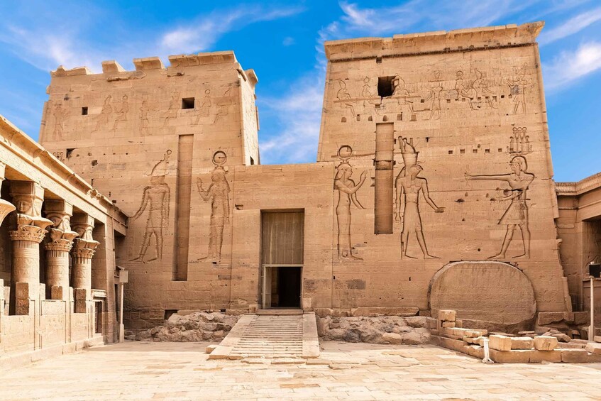 An ancient Egyptian temple with hieroglyphs and columns. 3