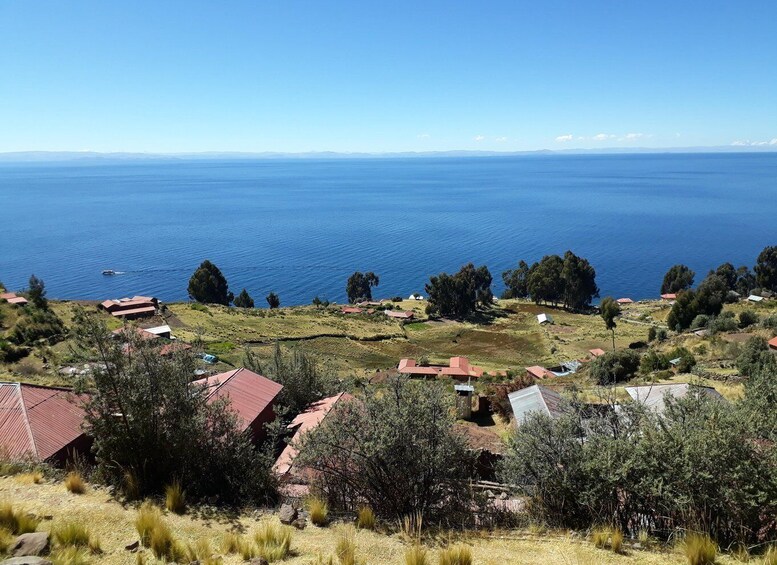 A coastal village with houses and a view of the ocean. 2