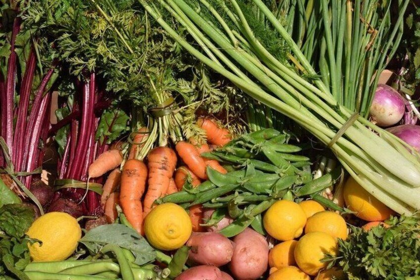 A variety of fresh vegetables including carrots, potatoes, and green beans. 5