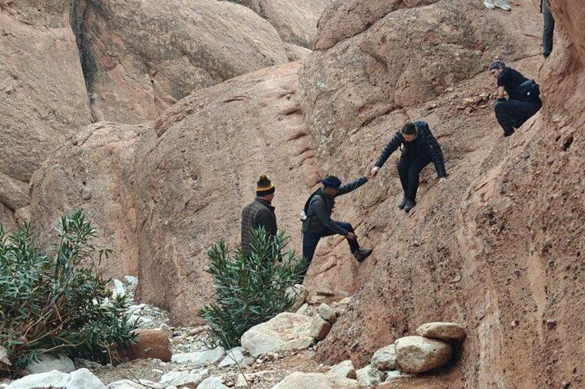 People climbing a rocky mountain. 3