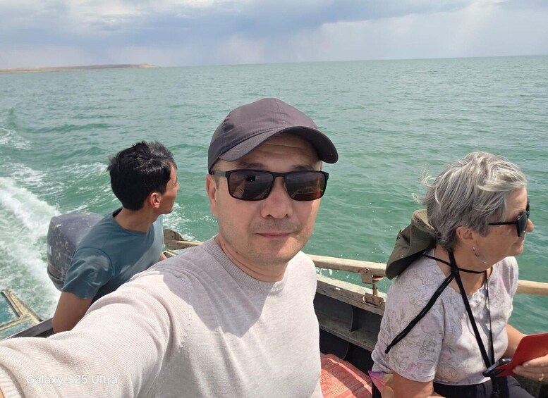 A boat on a calm sea with a clear sky. 4