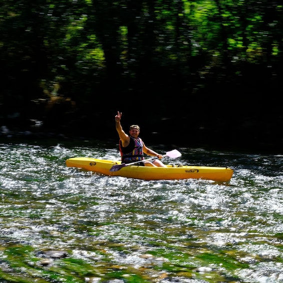 A person kayaking on a river. 2