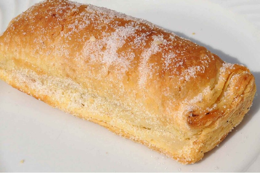 A loaf of bread dusted with sugar. 5