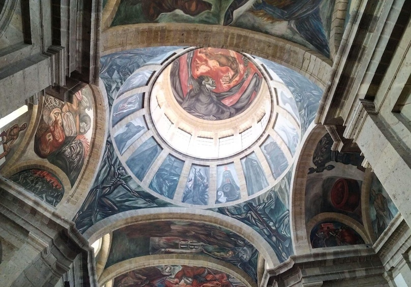 A domed ceiling with intricate frescoes and architectural details. 1