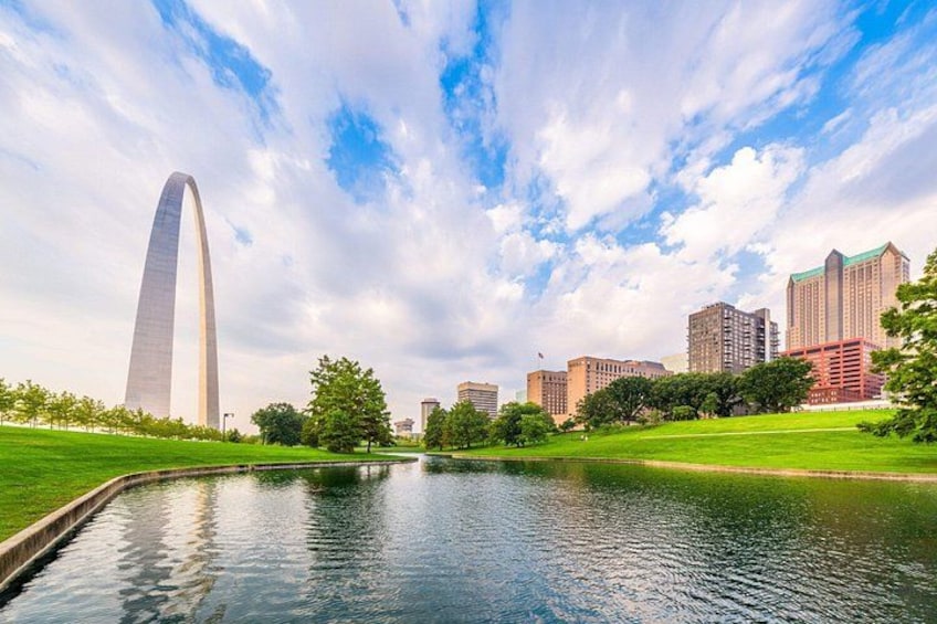A river, a tall monument, and city buildings. 5