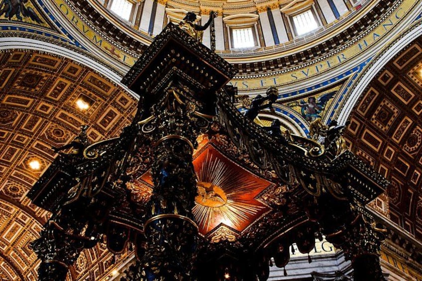 An ornate architectural structure with intricate carvings and a central radiant design. 3