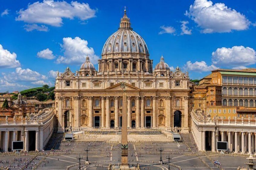 A grand historical building with a large dome, classical architecture, and a wide open plaza. 1