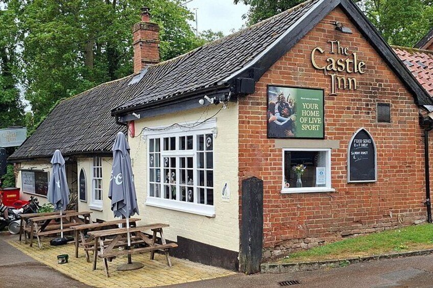 The Castle Inn, a traditional brick building with a sign advertising 'Your Home of Live Sport.' 2