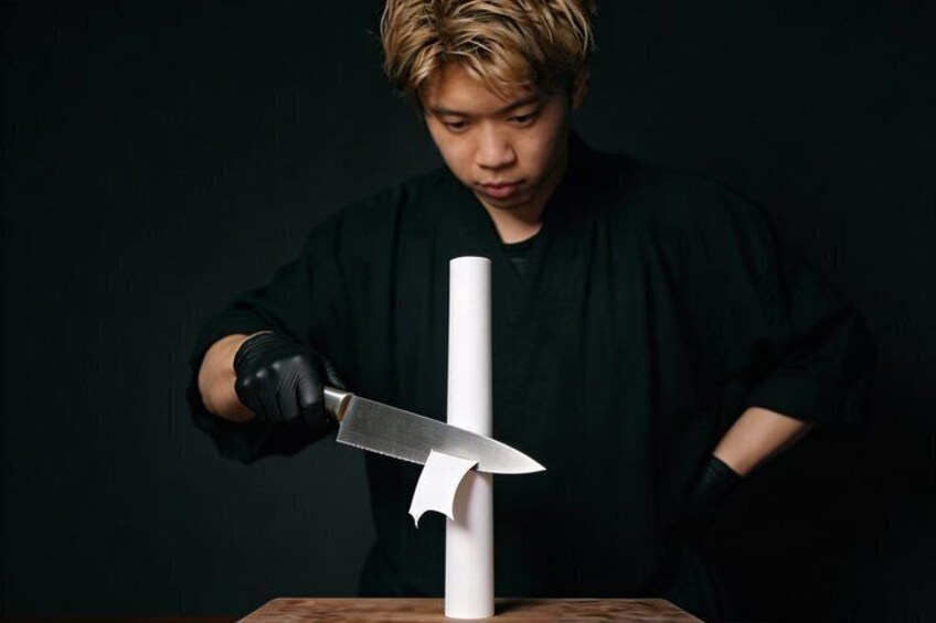 A person holding a knife near a white object. 3