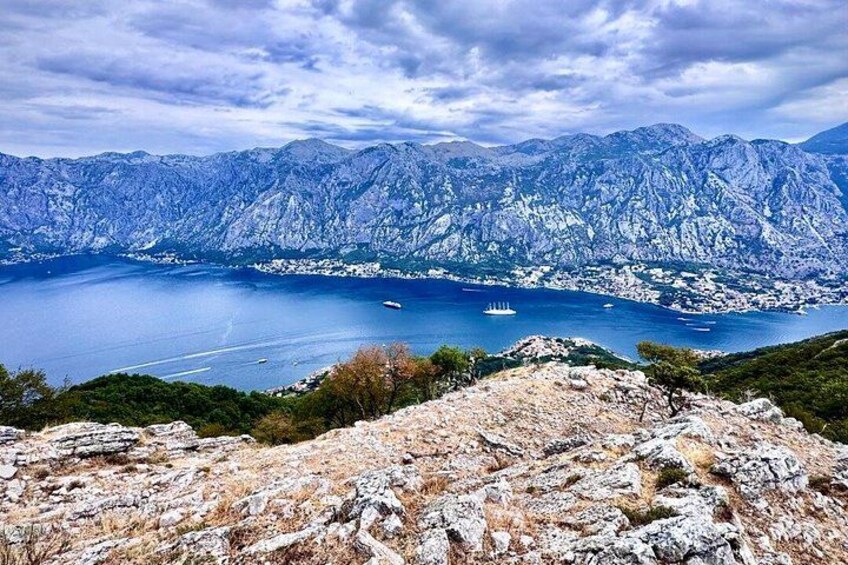 A mountainous landscape with a lake and a ship. 1