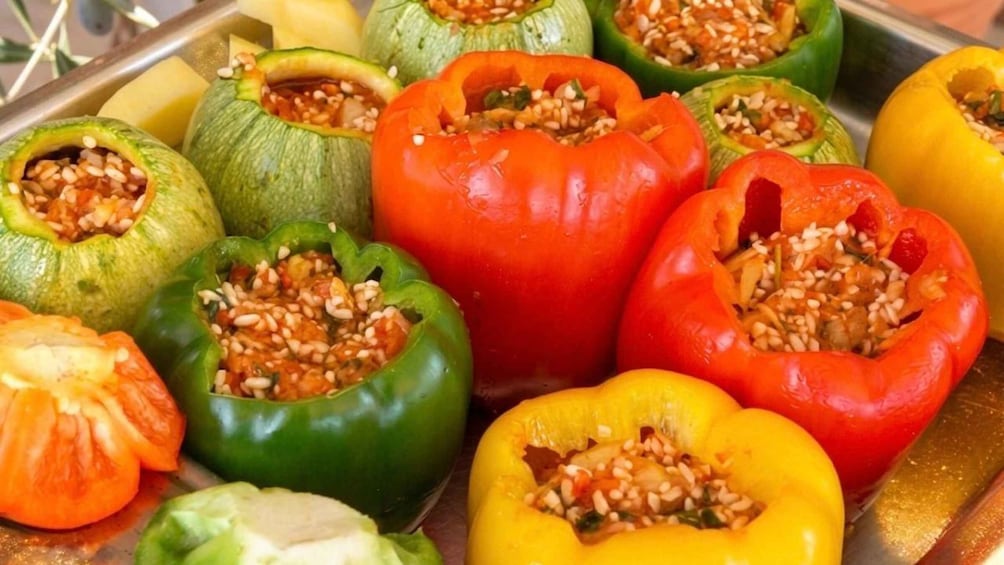A variety of stuffed bell peppers in different colors. 2