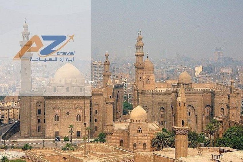 A large mosque with multiple domes and minarets, surrounded by a cityscape. 3