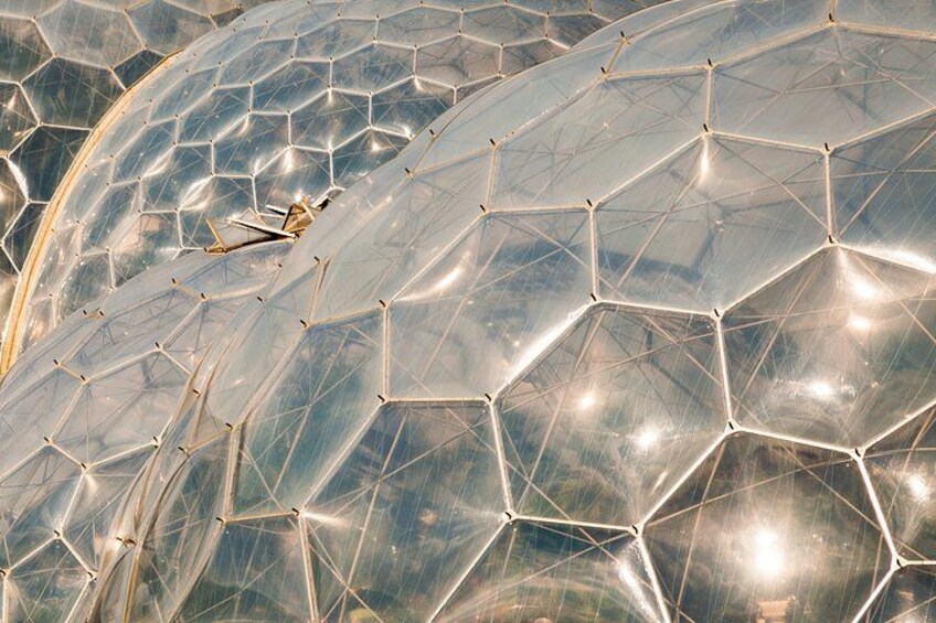 A large transparent dome structure with a geometric pattern. 4