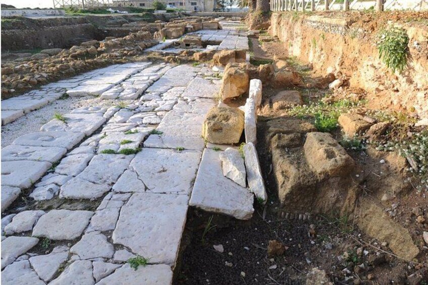 Ancient stone pavement, a collapsed stone structure, and a trench. 3