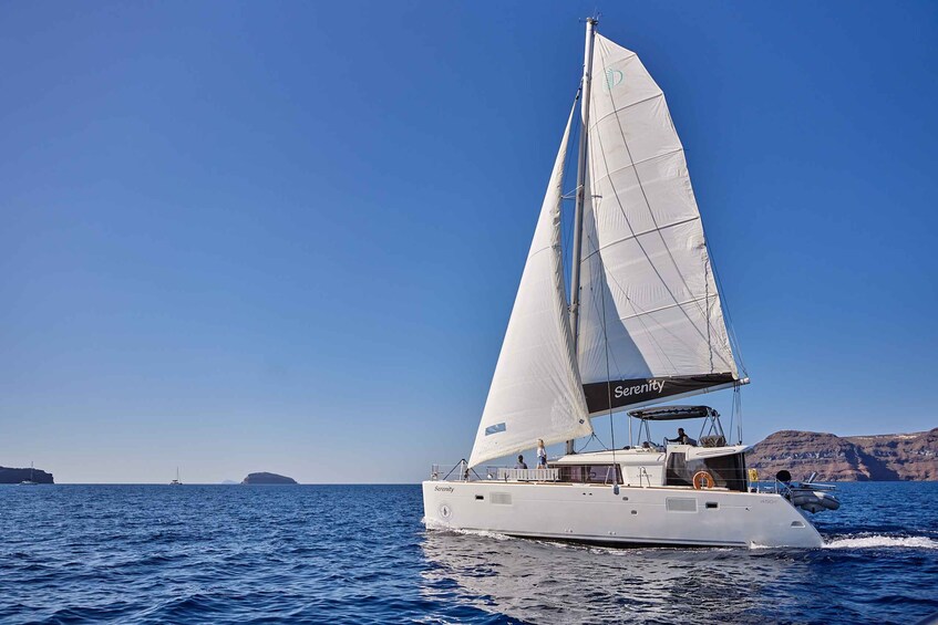A sailboat named Serenity sailing on a calm sea with clear skies. 2