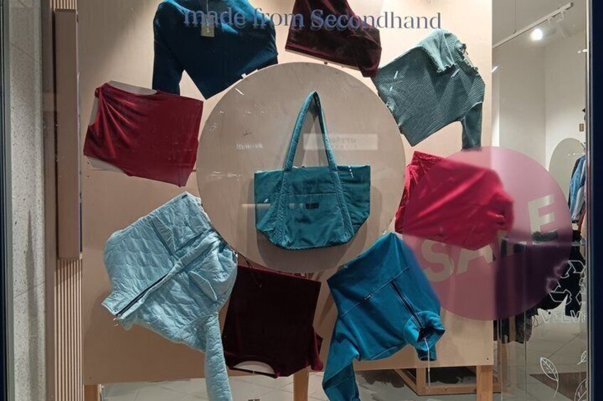 A display of handbags in a store window. 1