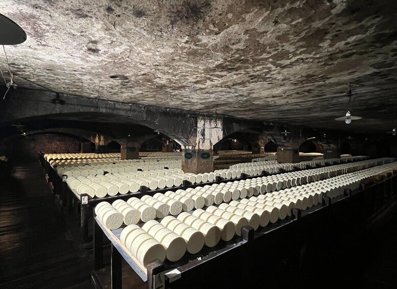 A large underground storage area with rows of cylindrical containers. 5