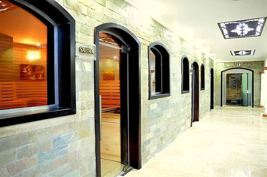 A spa with arched windows and a sign labeled 'SAUNA'. 5