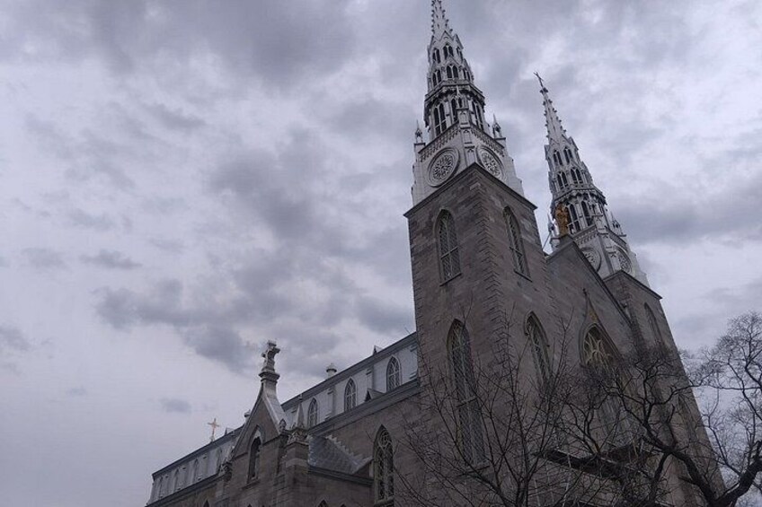 A large church with two tall spires and a clock tower. 4