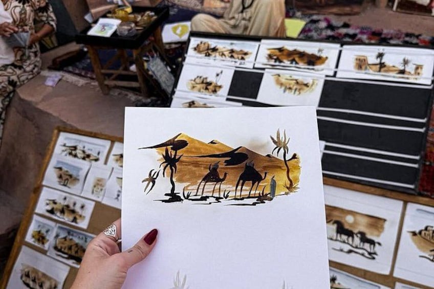 A hand holding a card with a wildlife illustration, surrounded by other cards with similar designs. 5