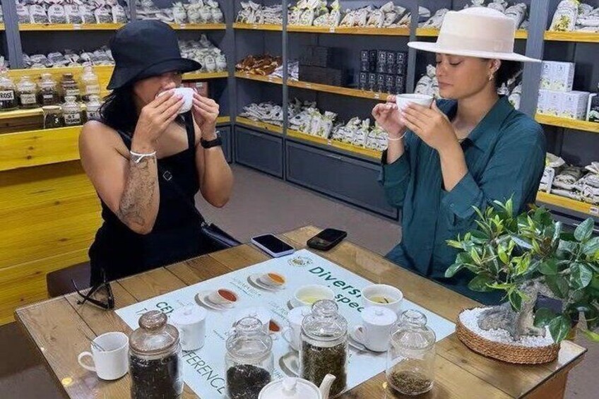 Two people at a table with coffee cups and a menu in a cafe setting. 3