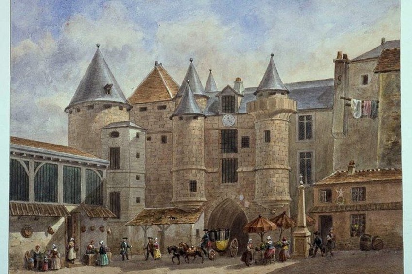 A historical building with towers and a courtyard with people and horse-drawn carriages. 4