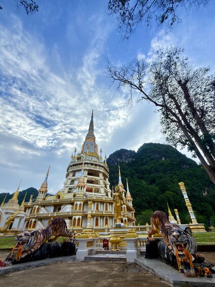A temple with golden spires and statues of animals. 3