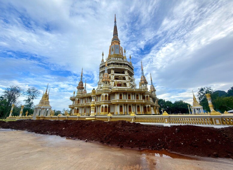 A large, ornate temple complex with multiple spires and golden decorations. 2