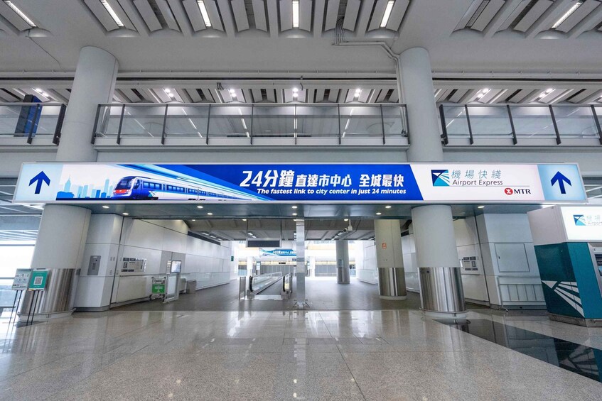 A spacious airport terminal with a large sign advertising a 24-minute express train service to the city center. 3