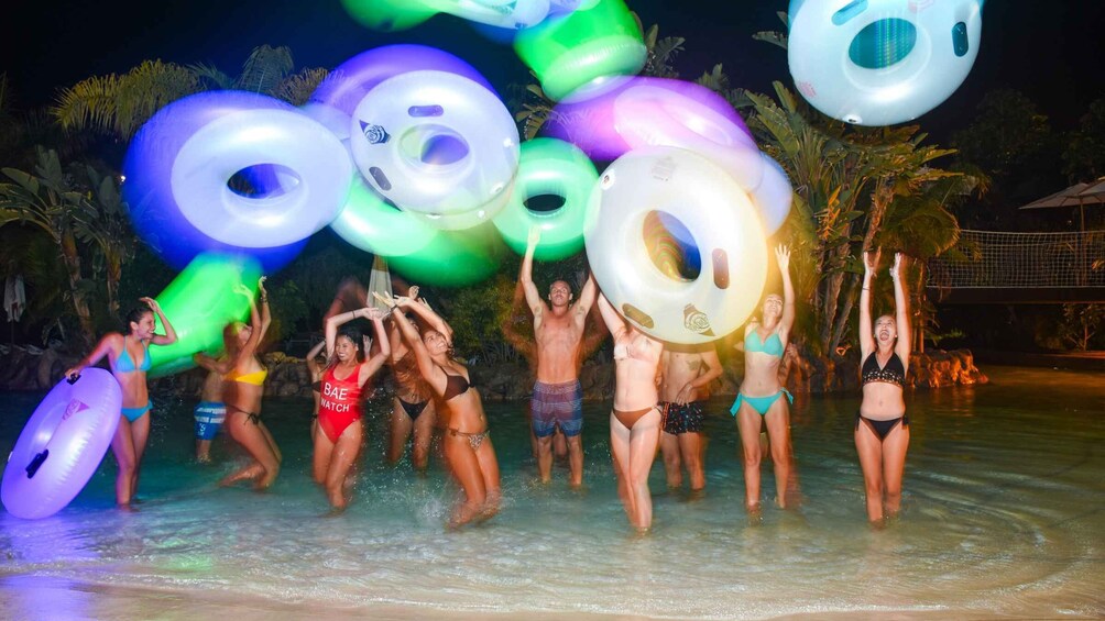 People in a water park with inflatable rings. 2