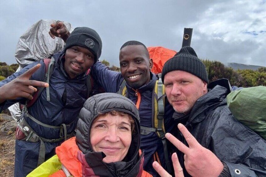 A group of people with backpacks in a natural setting. 1